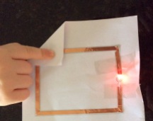 8 year old daughter created her first simple circuit using conductive tape, battery & LED